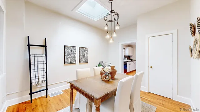 a view of a dining room with furniture and window