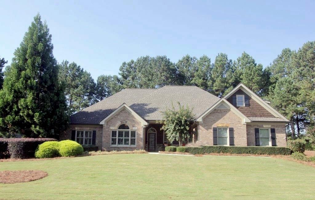 2100 Seths Ridge Loganville, GA 30052 - Photo 1 of 1 a front view of house with yard and green space