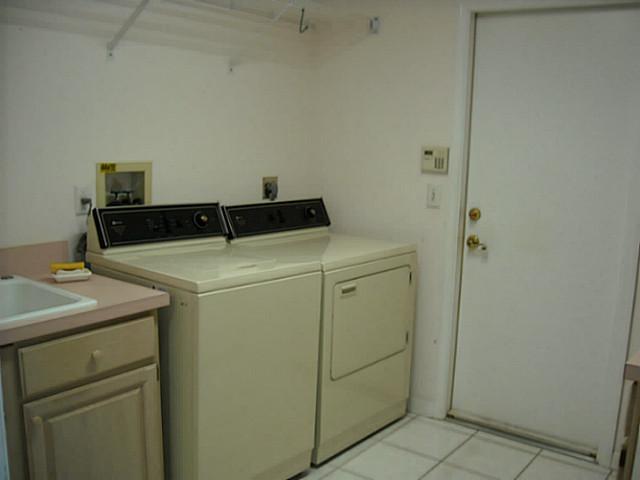 5 Miramar Road Sewall's Point, FL 34996 - Photo 19 of 24 a utility room with dryer and washer
