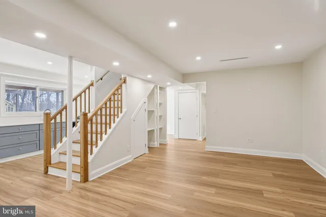a view of an entryway with wooden floor