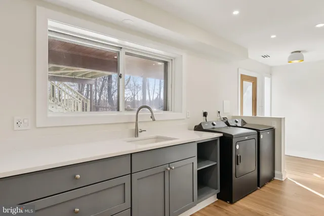 a view of a sink and a window