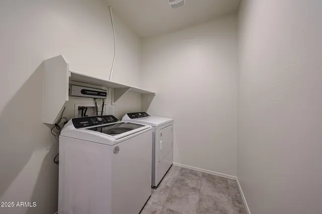 a kitchen with stainless steel appliances granite countertop a sink and a stove