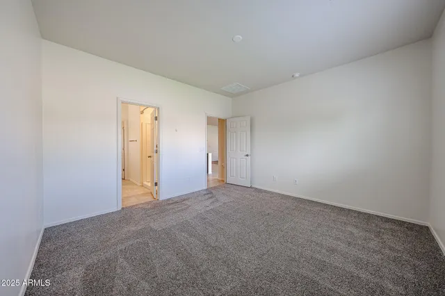 a bathroom with a sink a toilet a shower and a mirror