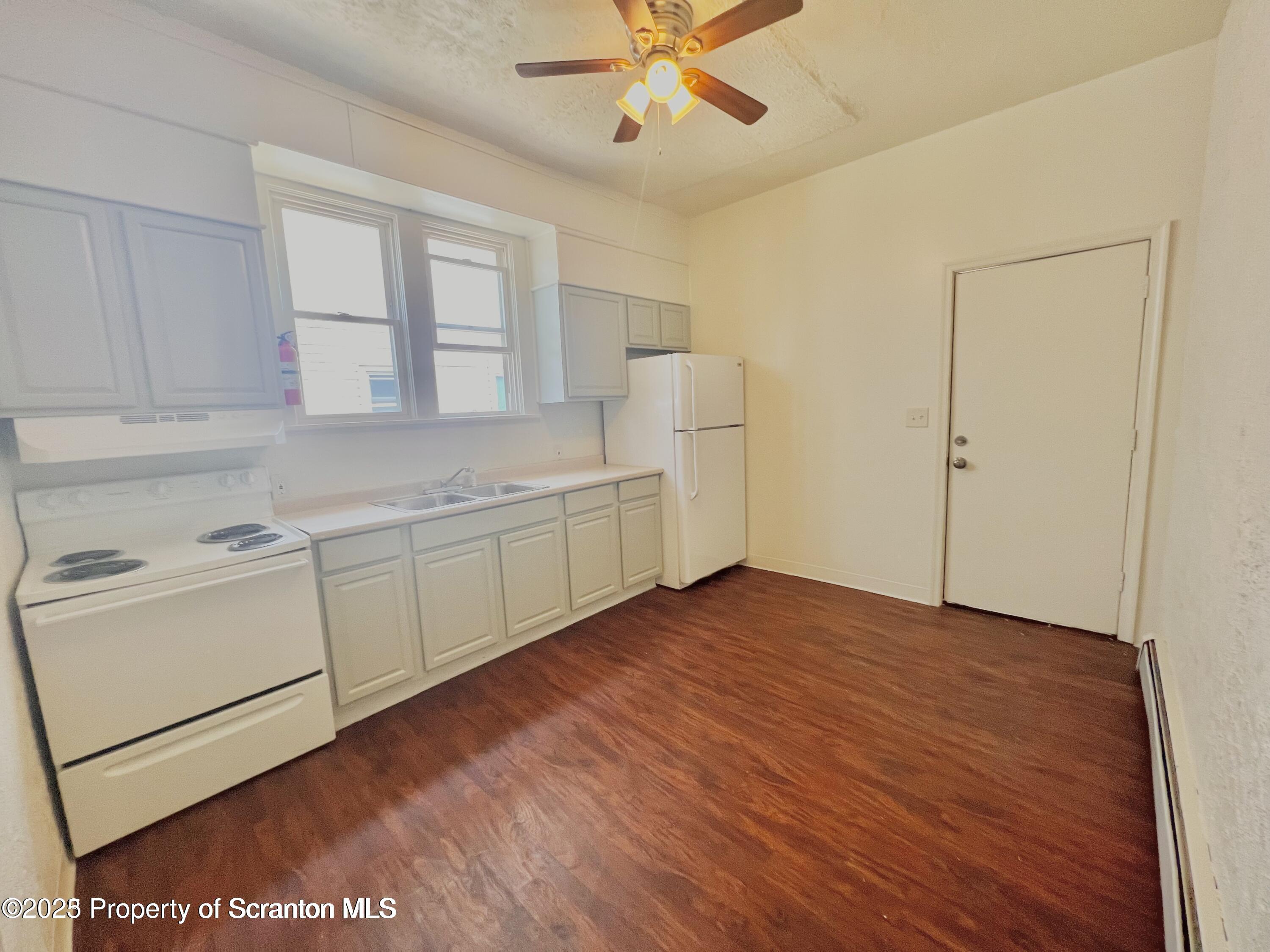 1930 Boulevard Avenue, Unit 1 Scranton, PA 18509 - Photo 2 of 9 a view of a livingroom with an empty kitchen