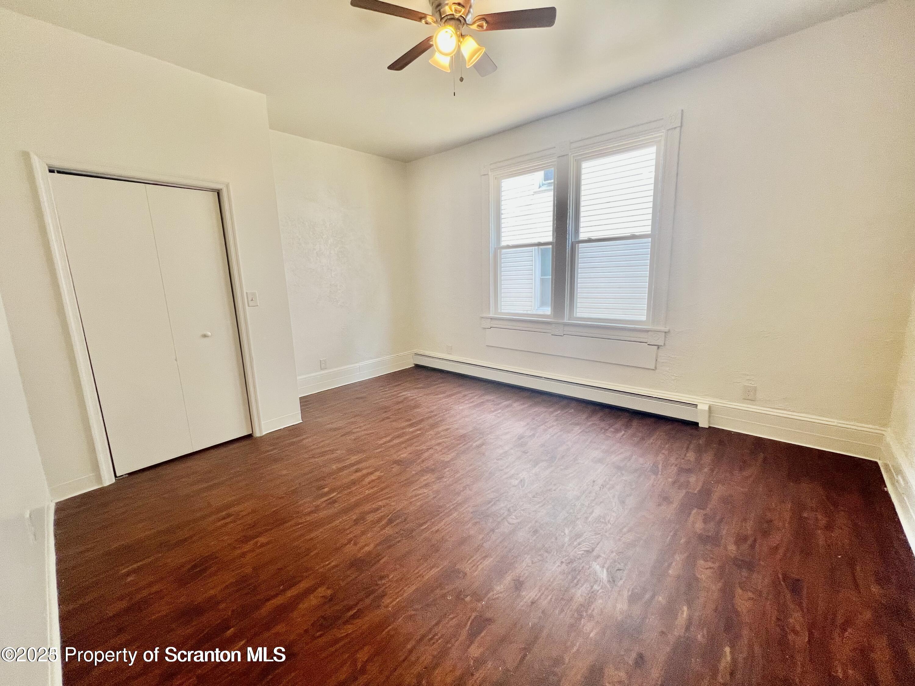 1930 Boulevard Avenue, Unit 1 Scranton, PA 18509 - Photo 9 of 9 wooden floor in an empty room with a window