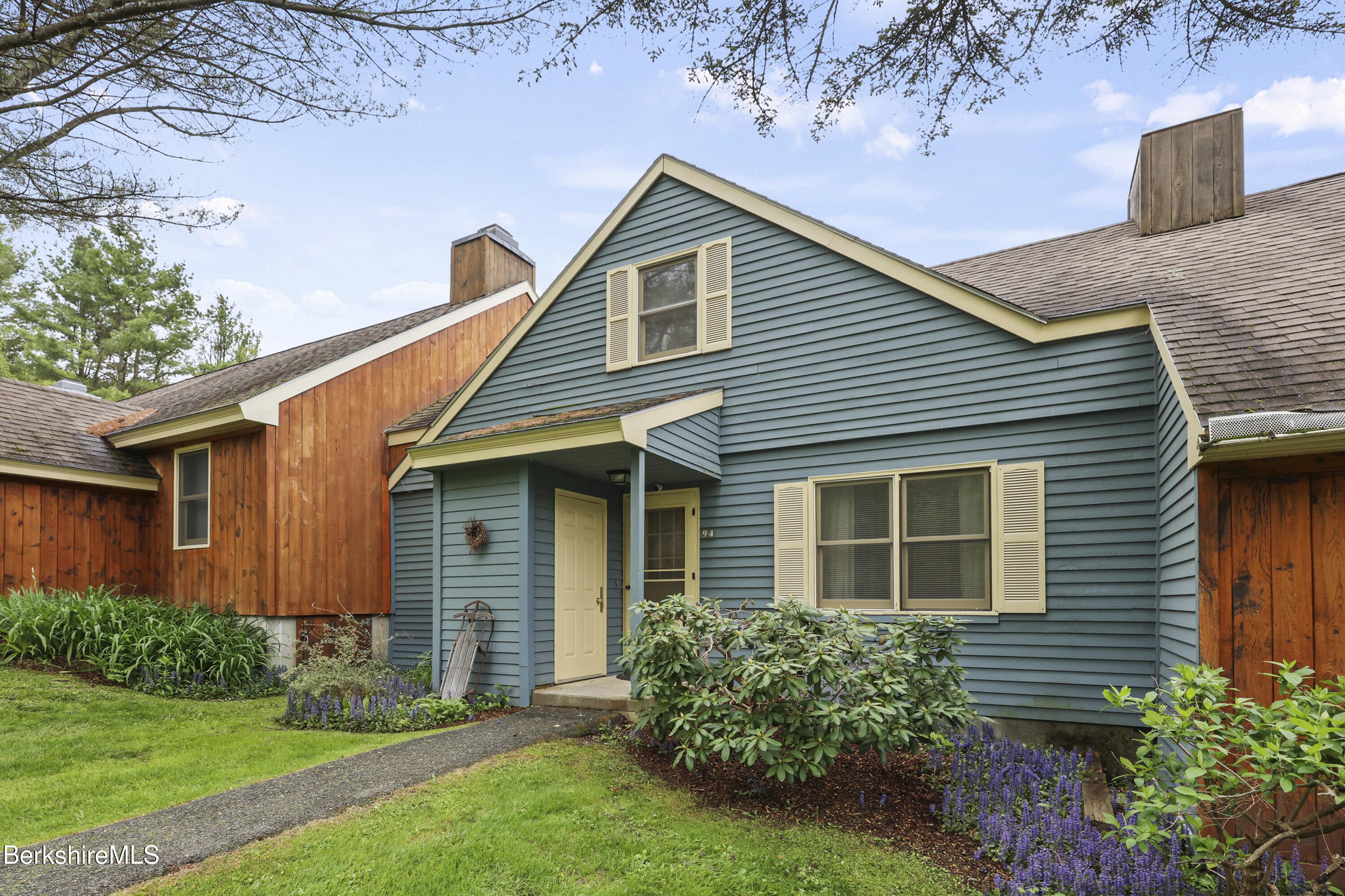 94 Corey Road, Unit D Hancock, MA 01237 - Photo 1 of 45 a front view of a house with garden