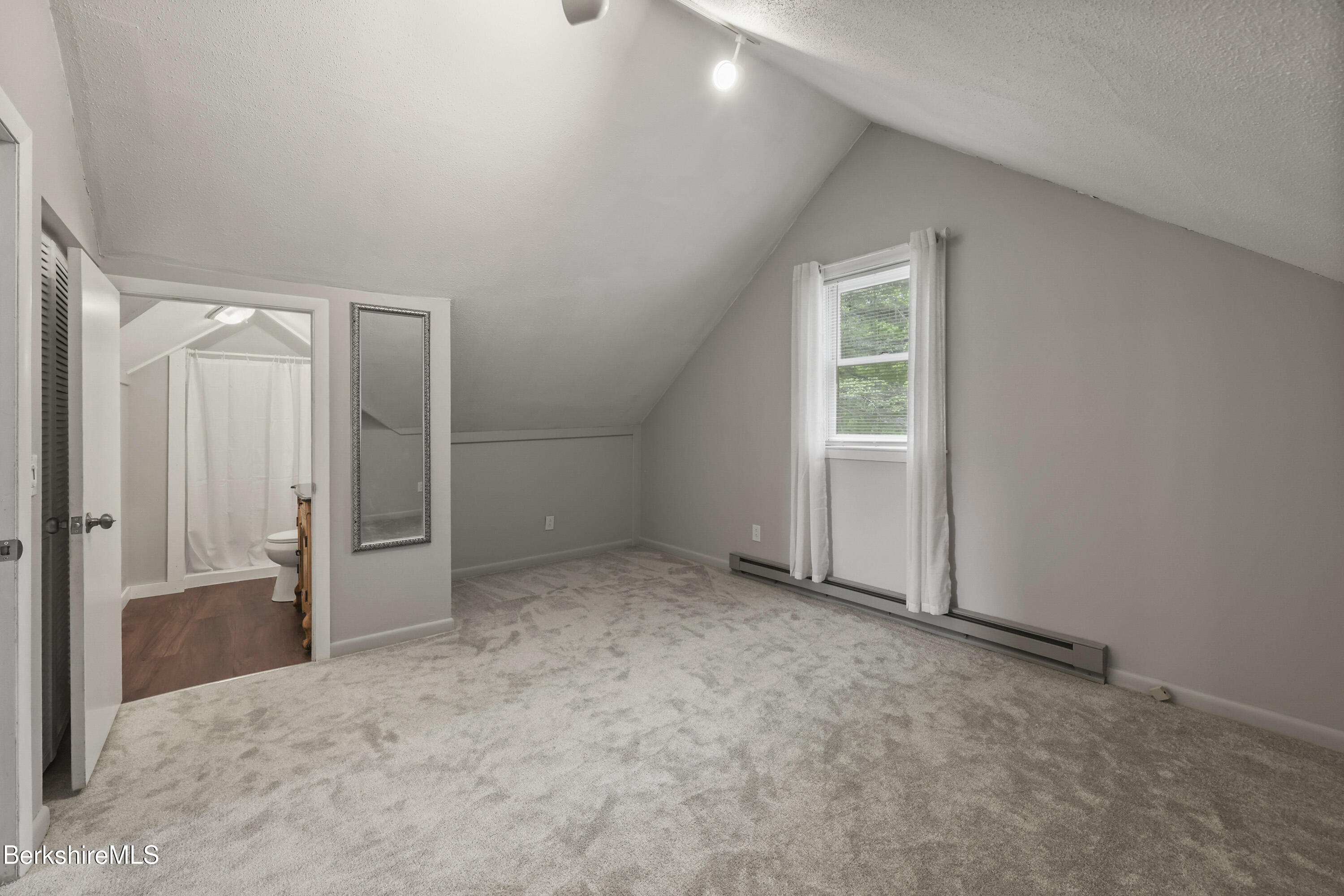 94 Corey Road, Unit D Hancock, MA 01237 - Photo 19 of 45 an empty room with windows and closet
