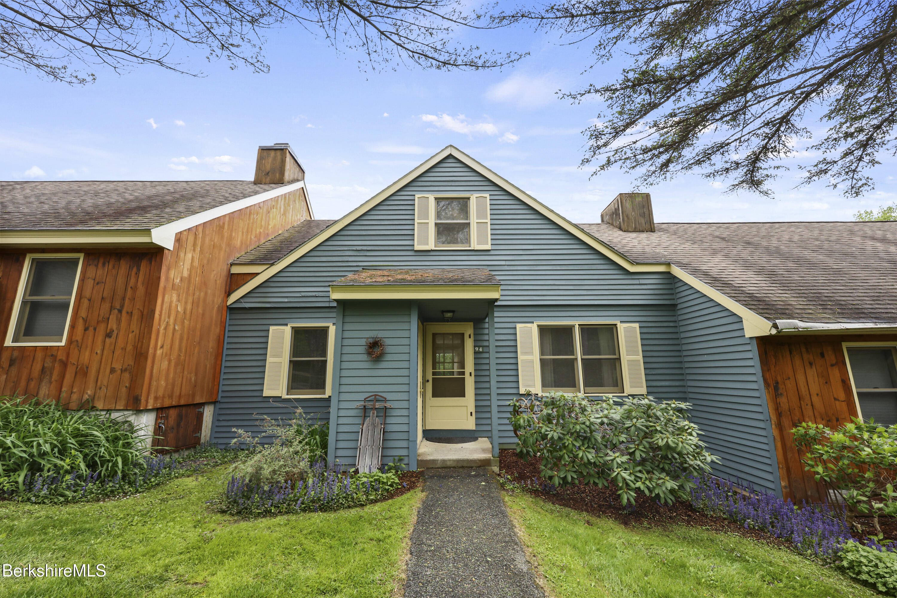 94 Corey Road, Unit D Hancock, MA 01237 - Photo 2 of 45 a front view of a house with garden