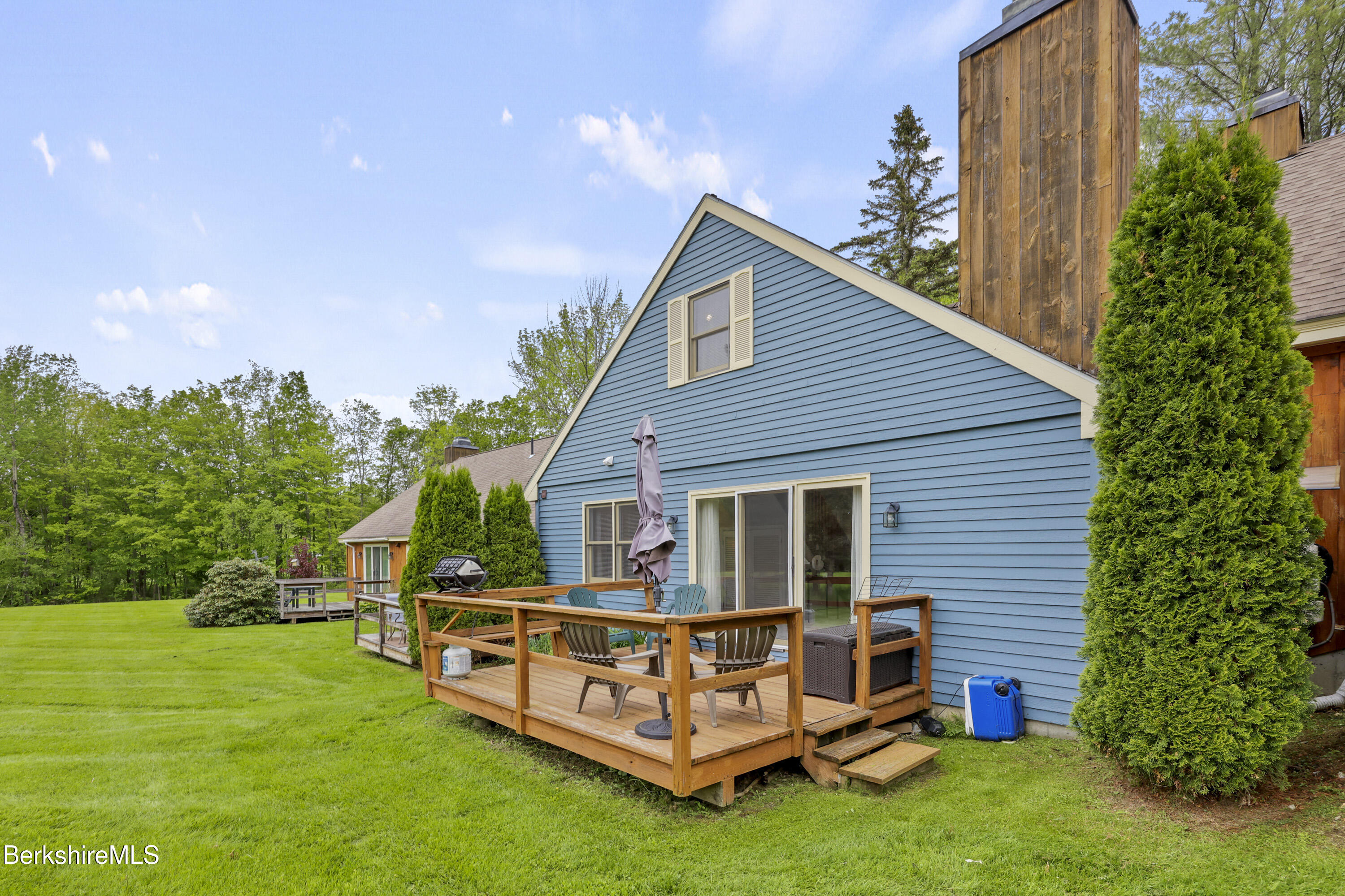 94 Corey Road, Unit D Hancock, MA 01237 - Photo 26 of 45 a view of a house with a backyard