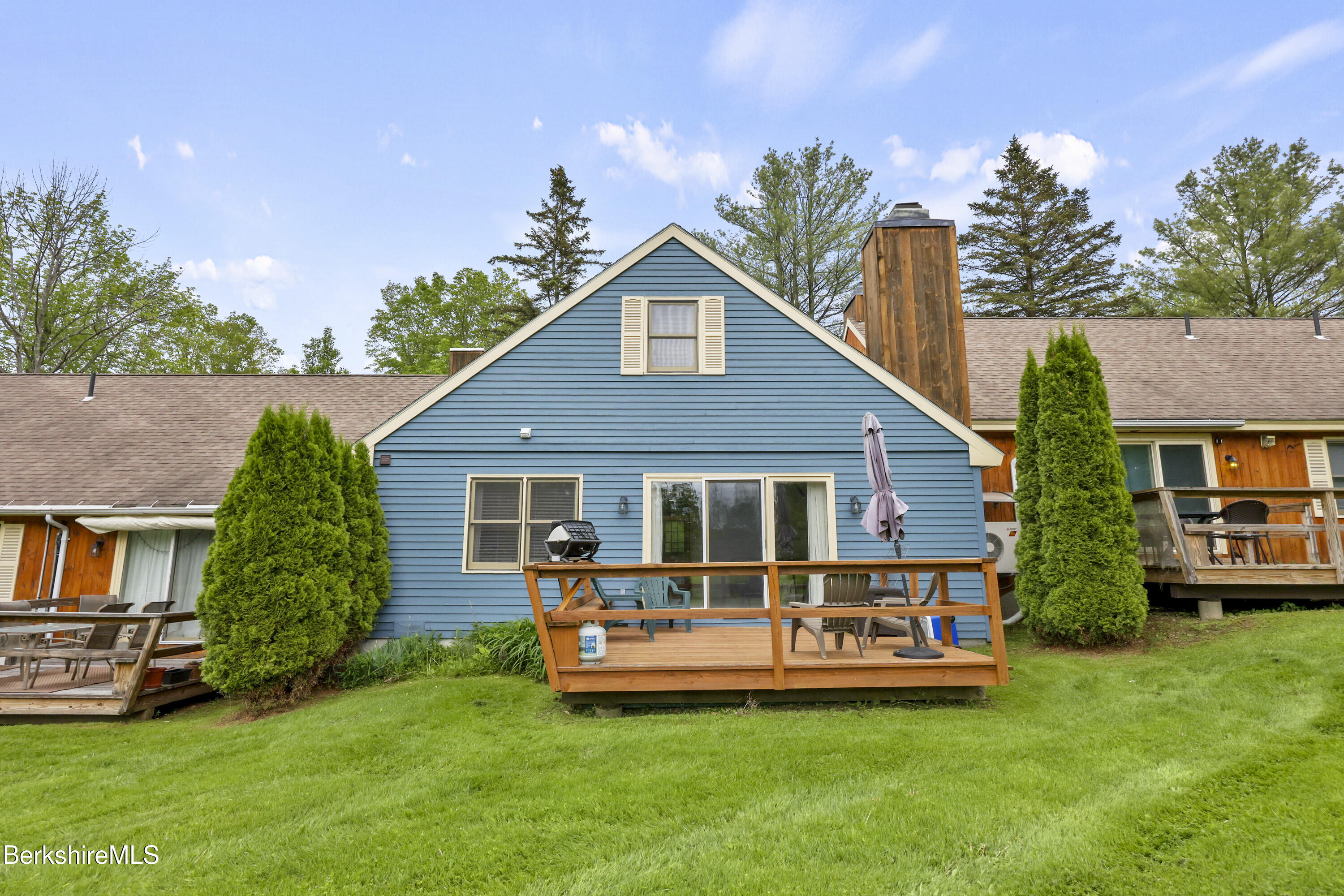 94 Corey Road, Unit D Hancock, MA 01237 - Photo 27 of 45 a front view of house with yard and green space