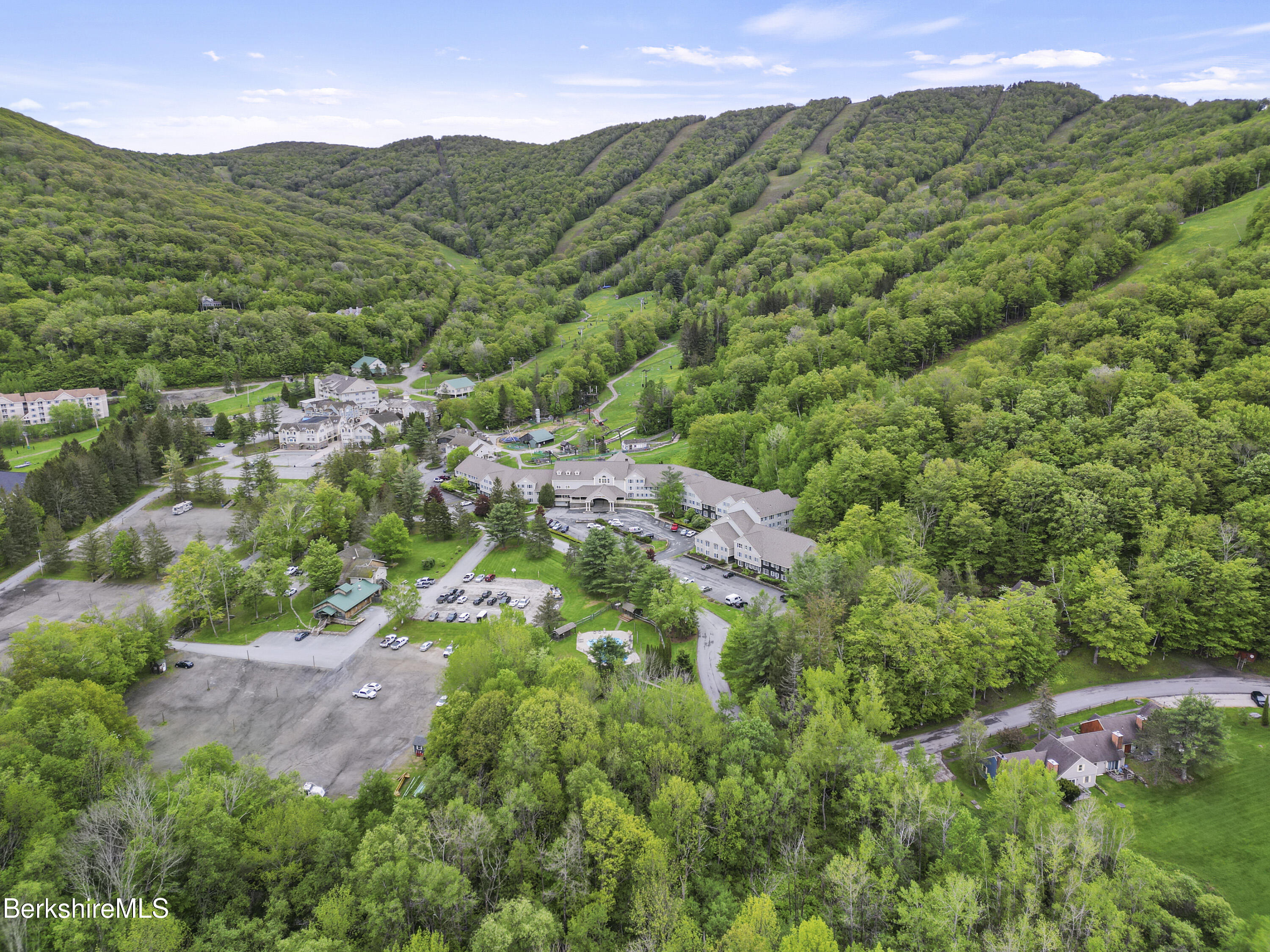 94 Corey Road, Unit D Hancock, MA 01237 - Photo 33 of 45 an aerial view of residential houses with outdoor space and trees all around