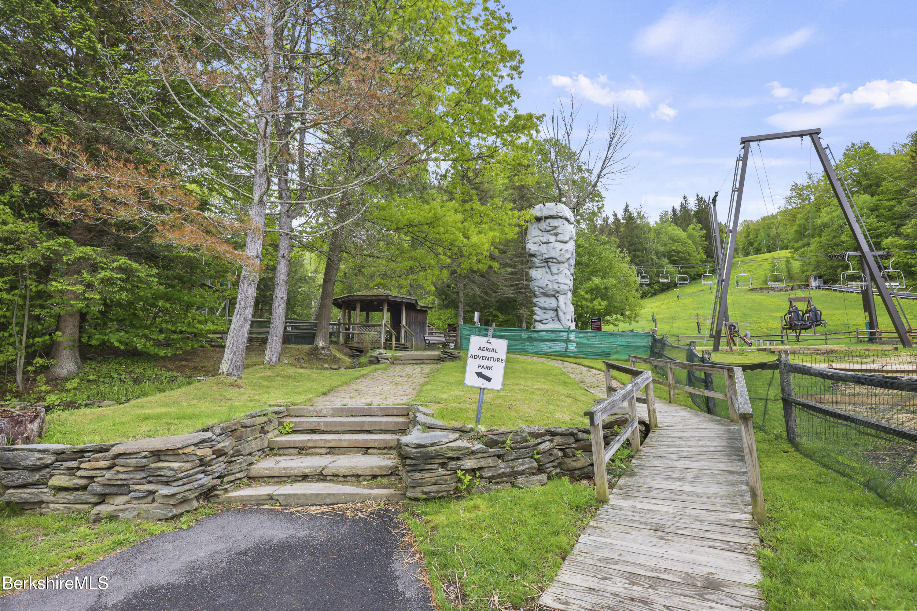 94 Corey Road, Unit D Hancock, MA 01237 - Photo 36 of 45 a view of a swimming pool and lounge chairs in back yard