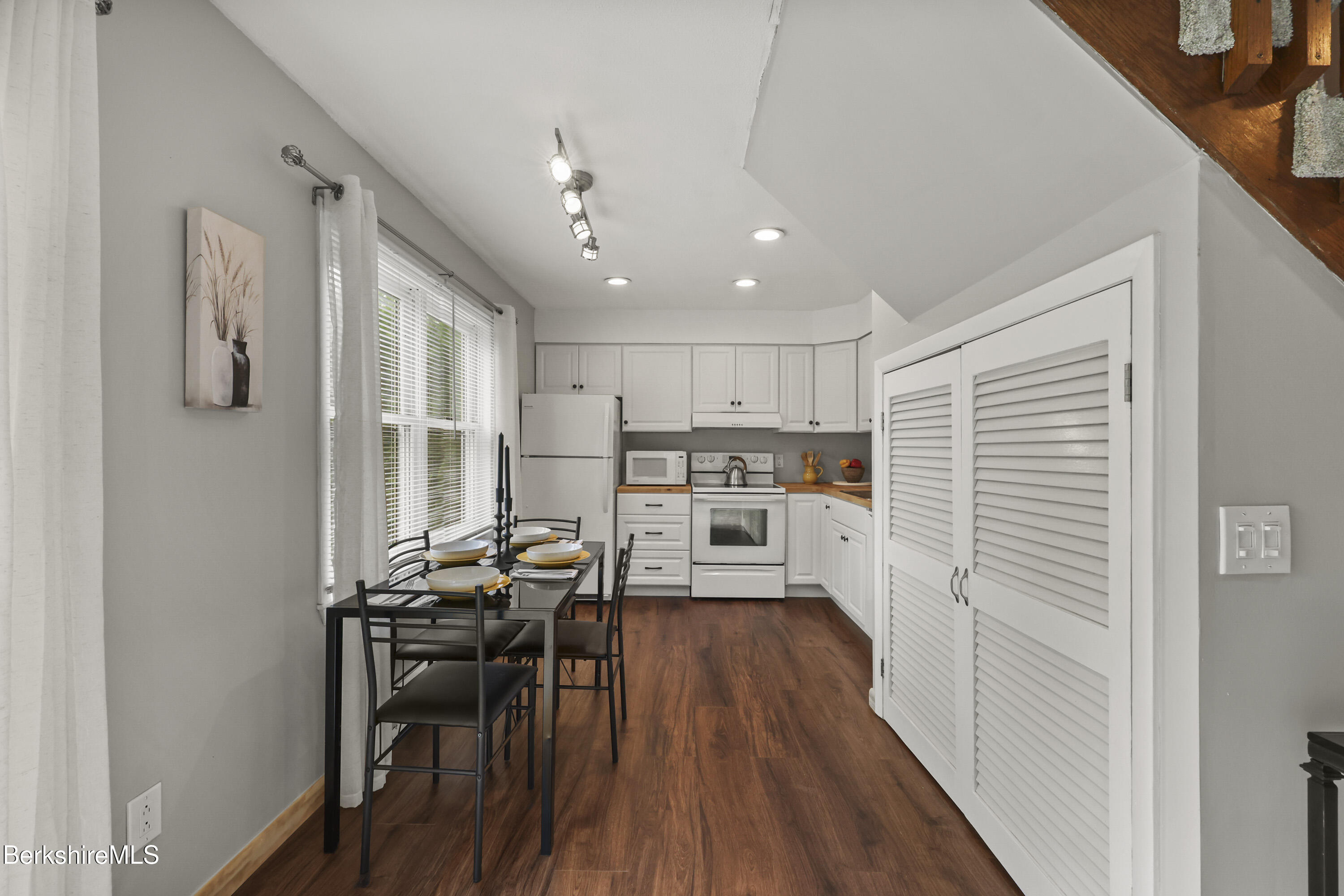 94 Corey Road, Unit D Hancock, MA 01237 - Photo 7 of 45 a kitchen with stainless steel appliances kitchen island granite countertop a refrigerator and a stove top oven
