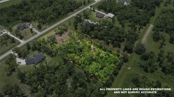 a view of a city with lush green forest