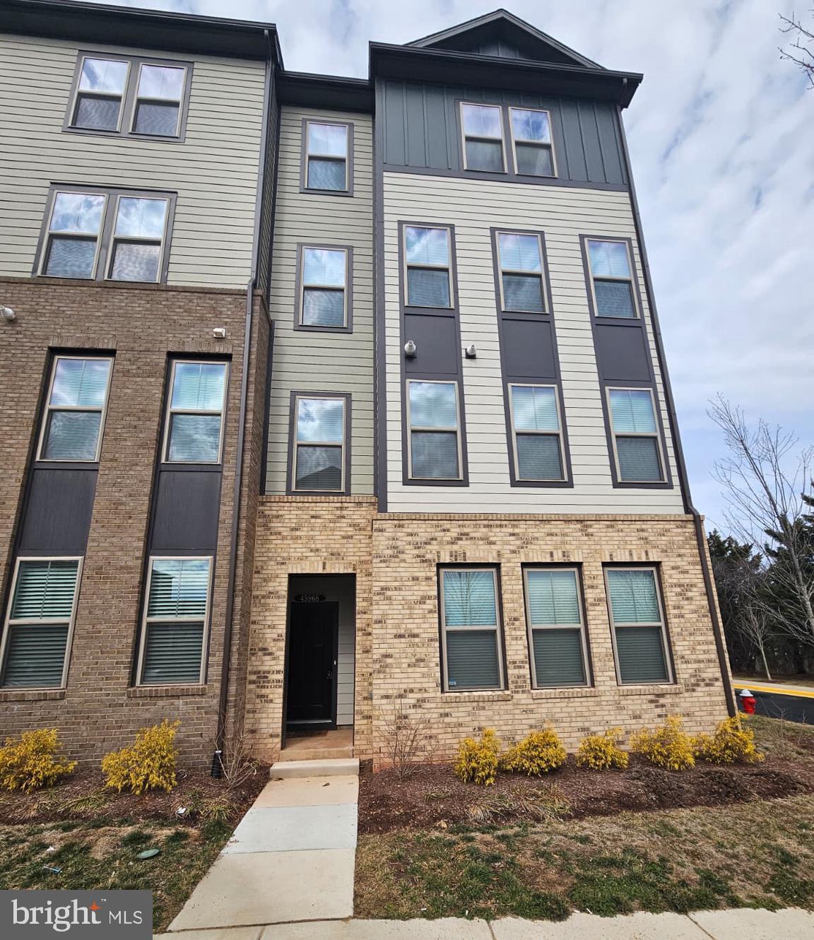 a front view of a multi story residential apartment building
