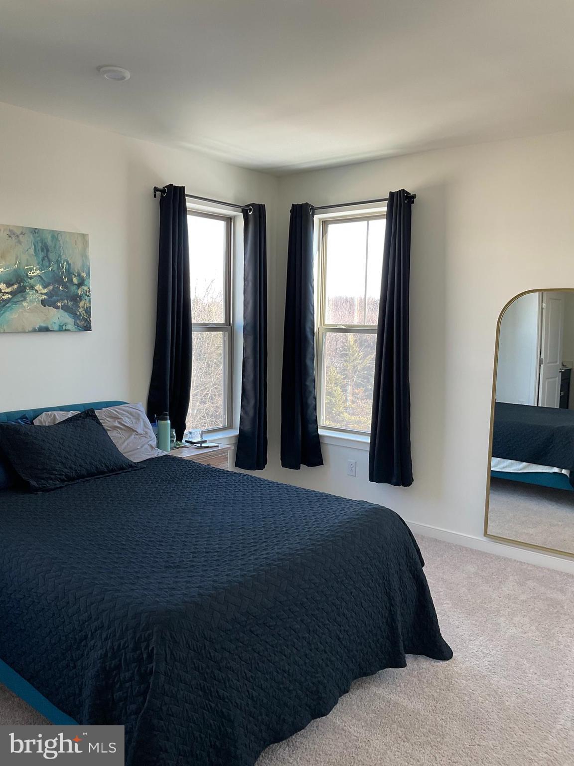 45968 Swallow Terrace Sterling, VA 20165 - Photo 15 of 27 a bedroom with a bed and a large window