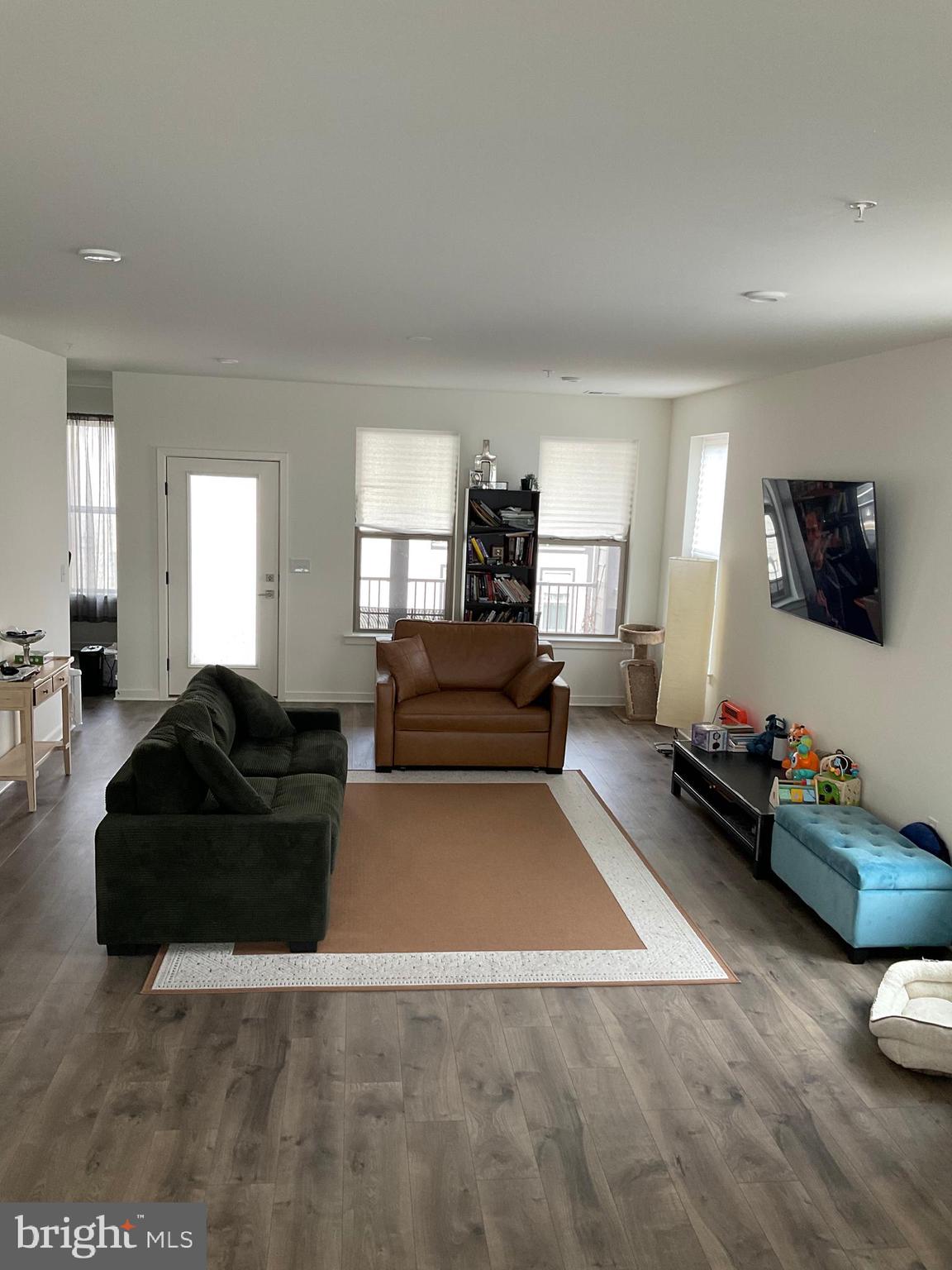 45968 Swallow Terrace Sterling, VA 20165 - Photo 22 of 27 a living room with furniture and a flat screen tv