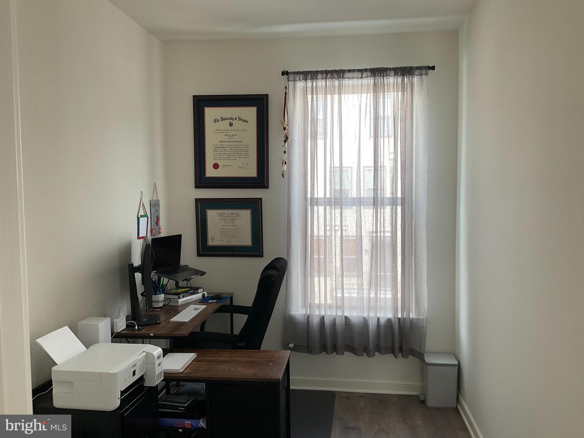 45968 Swallow Terrace Sterling, VA 20165 - Photo 9 of 27 a living room with furniture and a window