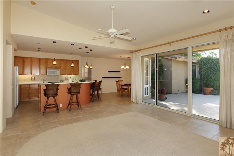 78780 Rio Seco La Quinta, CA 92253 - Photo 11 of 37 a living room with lots of furniture and a large window