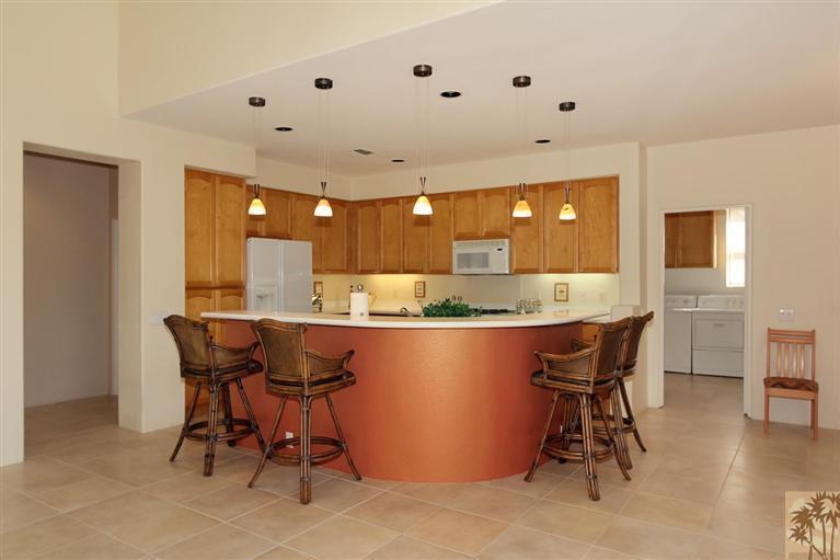 78780 Rio Seco La Quinta, CA 92253 - Photo 12 of 37 a large kitchen with a table and chairs
