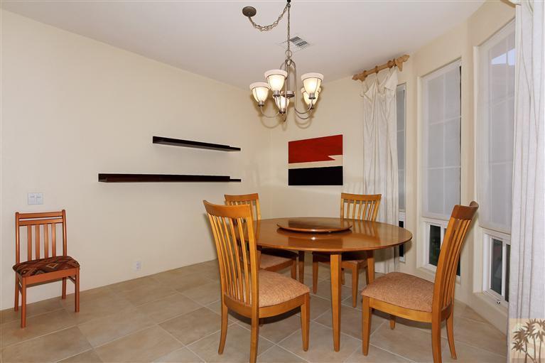 78780 Rio Seco La Quinta, CA 92253 - Photo 15 of 37 a view of a dining room with furniture and wooden floor