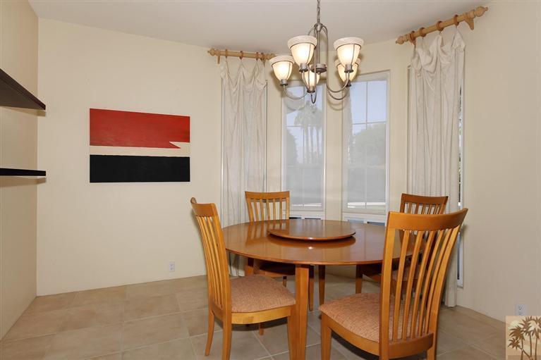 78780 Rio Seco La Quinta, CA 92253 - Photo 16 of 37 a view of a dining room with furniture and chandelier
