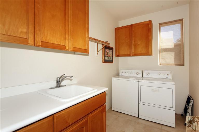 78780 Rio Seco La Quinta, CA 92253 - Photo 19 of 37 a utility room with dryer and washer