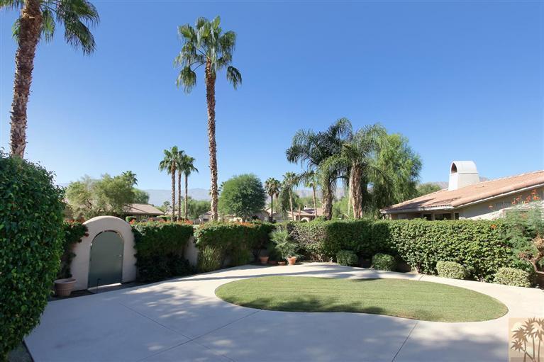 78780 Rio Seco La Quinta, CA 92253 - Photo 4 of 37 a view of a swimming pool with a yard