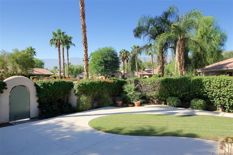78780 Rio Seco La Quinta, CA 92253 - Photo 5 of 37 a view of a swimming pool with a garden