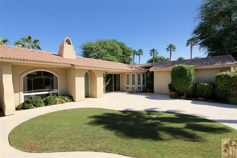 78780 Rio Seco La Quinta, CA 92253 - Photo 8 of 37 a front view of a house with a garden