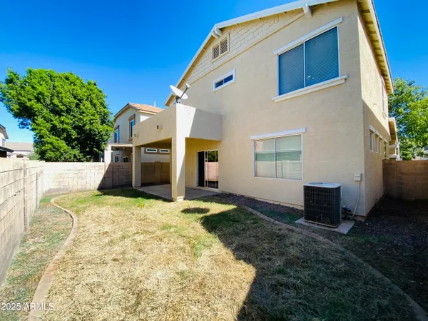 a backyard of a house with yard and garage