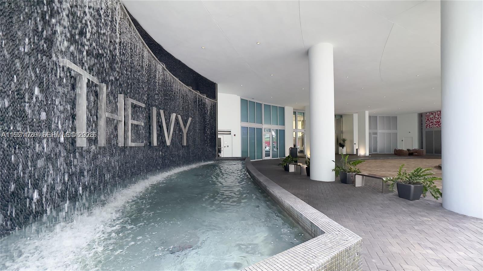 90 Southwest 3rd Street, Unit 4105 Miami, FL 33130 - Photo 2 of 30 a view of a house with backyard and trees