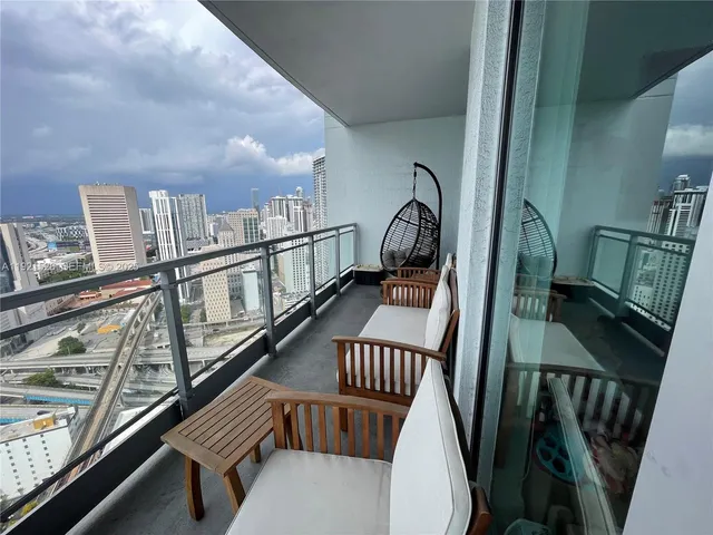 a view of swimming pool from a balcony