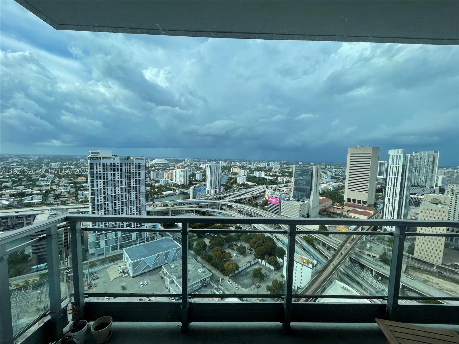 90 Southwest 3rd Street, Unit 4105 Miami, FL 33130 - Photo 8 of 27 a view of swimming pool from a balcony