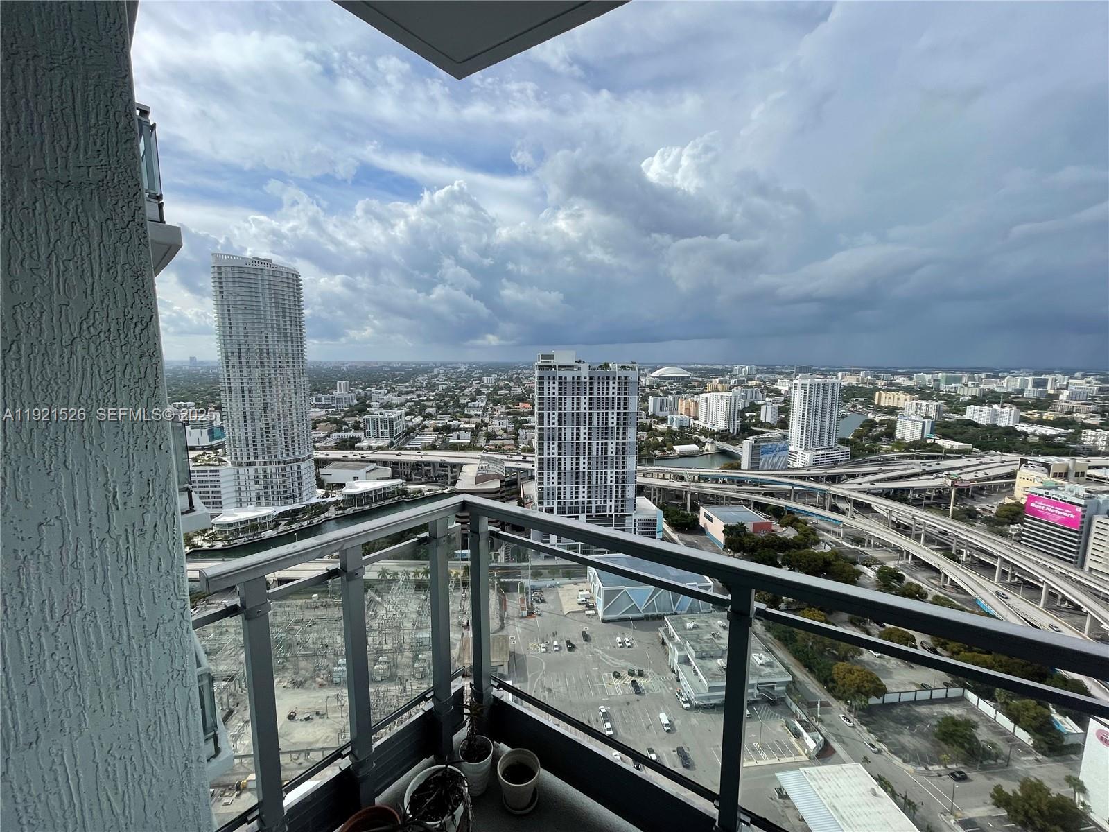 90 Southwest 3rd Street, Unit 4105 Miami, FL 33130 - Photo 10 of 27 a city view from a balcony