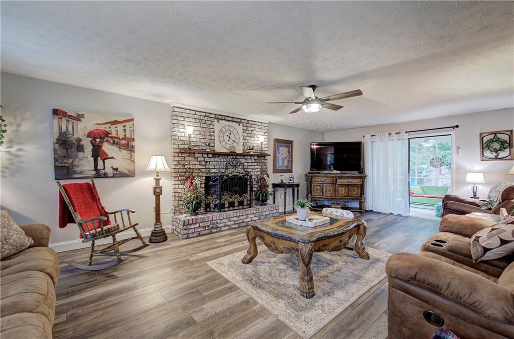 3637 Nebo Road Hiram, GA 30141 - Photo 13 of 63 a living room with furniture a fireplace and a window