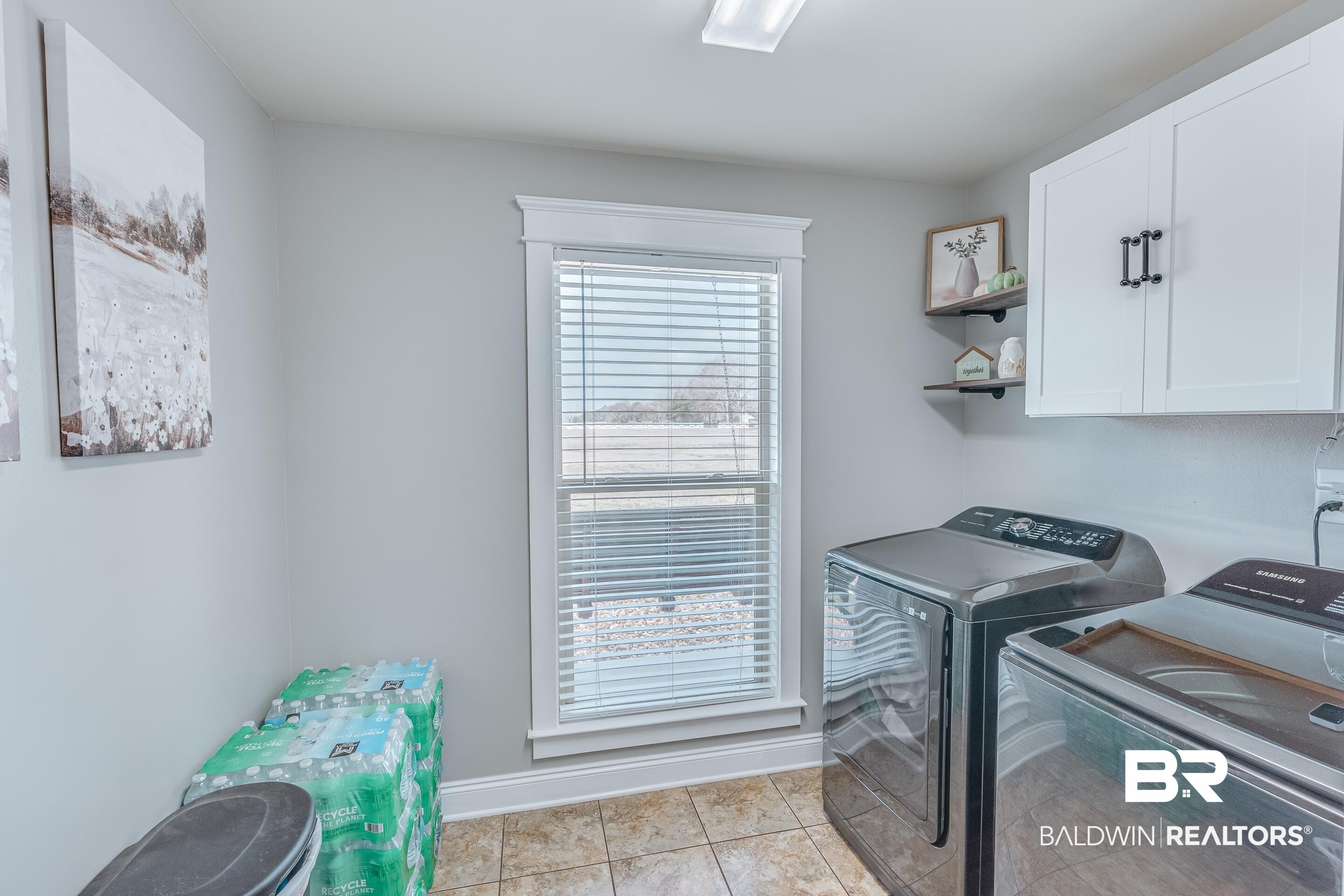 13235 Tom Gaston Road Mobile, AL 36695 - Photo 23 of 43 Clothes washing area with separate washer and dryer, light tile patterned floors, and cabinets