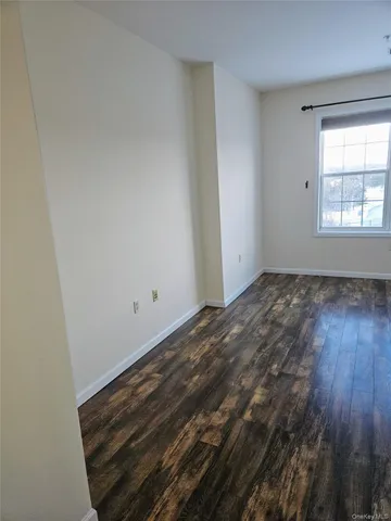 a view of a balcony with wooden floor