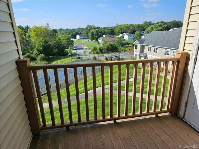a view of a garden with a wooden fence