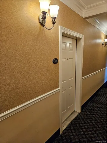 a view of a hallway with washer and dryer