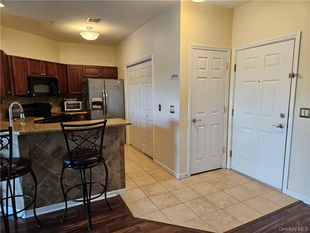 a kitchen with appliances and cabinets