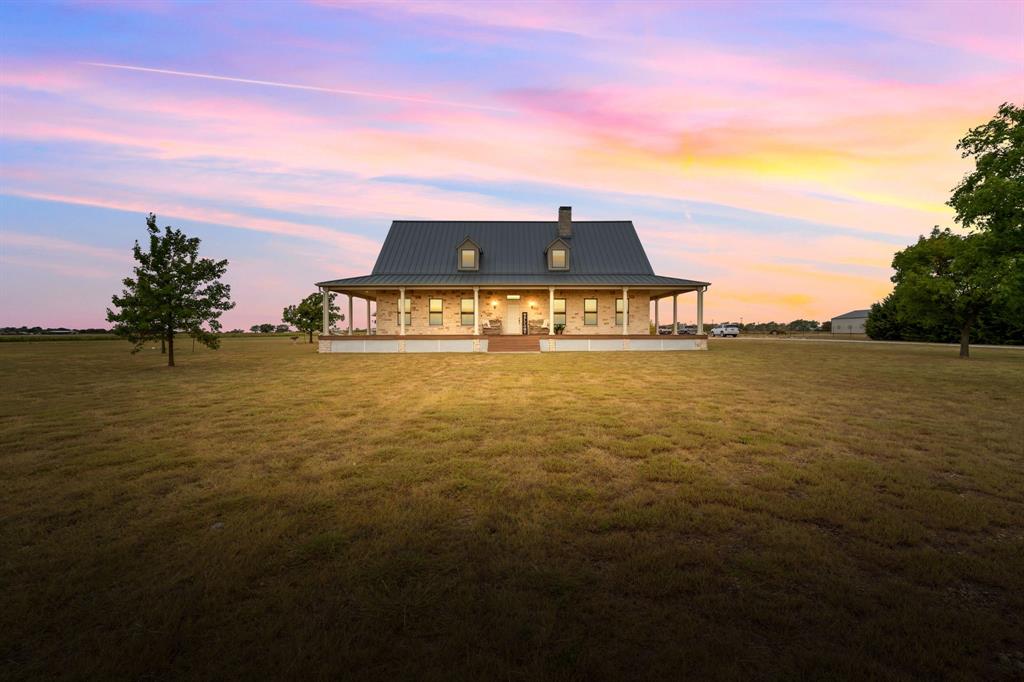 5751 Barnett Road Krum, TX 76249 - Photo 1 of 1 a view of a lake with a big yard