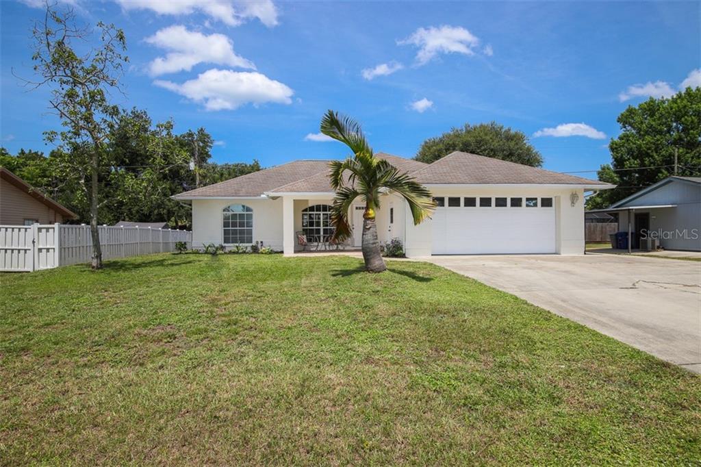 3230 Nocturne Road Venice, FL 34293 - Photo 1 of 1 a front view of a house with a yard