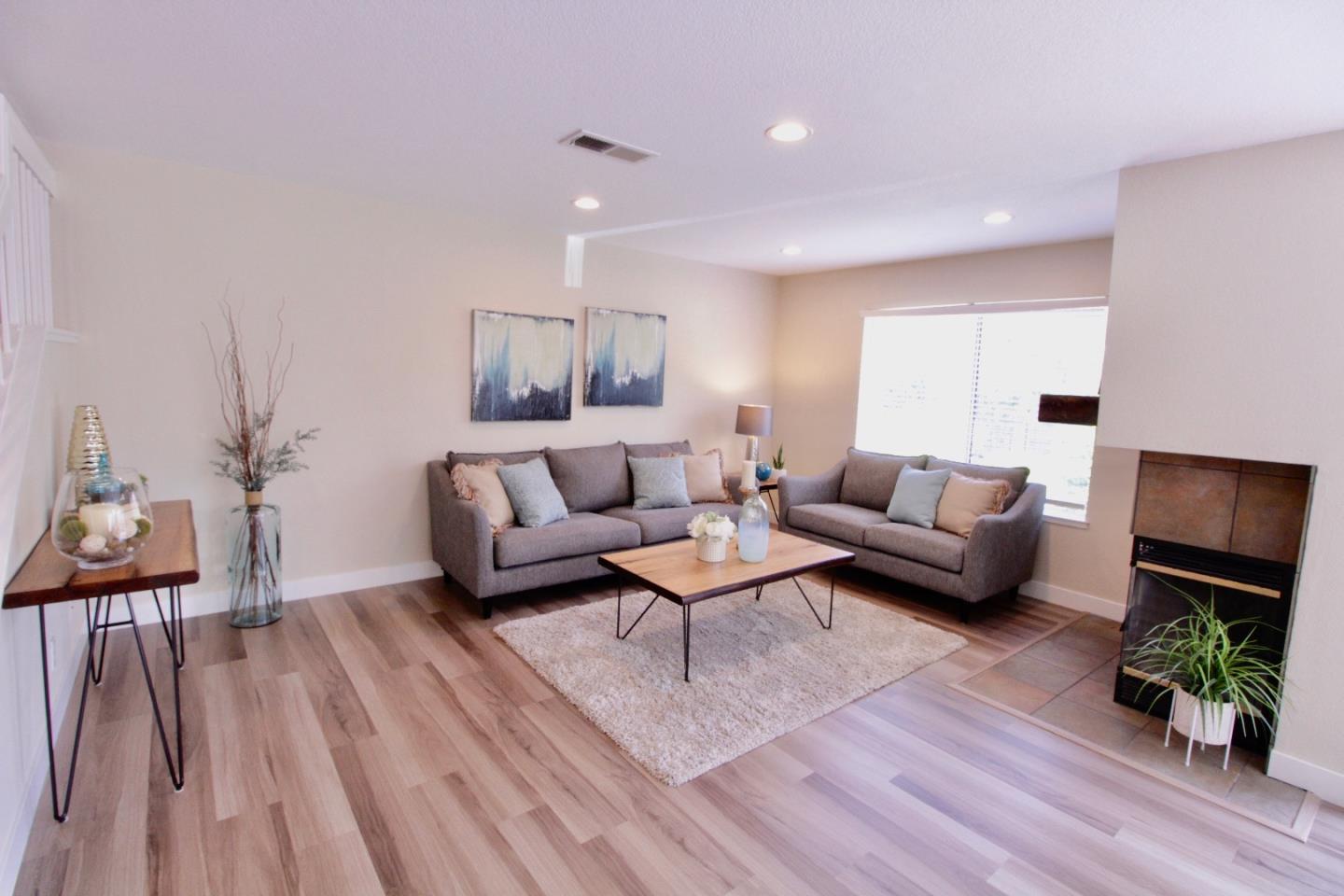 60 Cherryton Lane San Jose, CA 95136 - Photo 11 of 31 a living room with furniture and a wooden floor