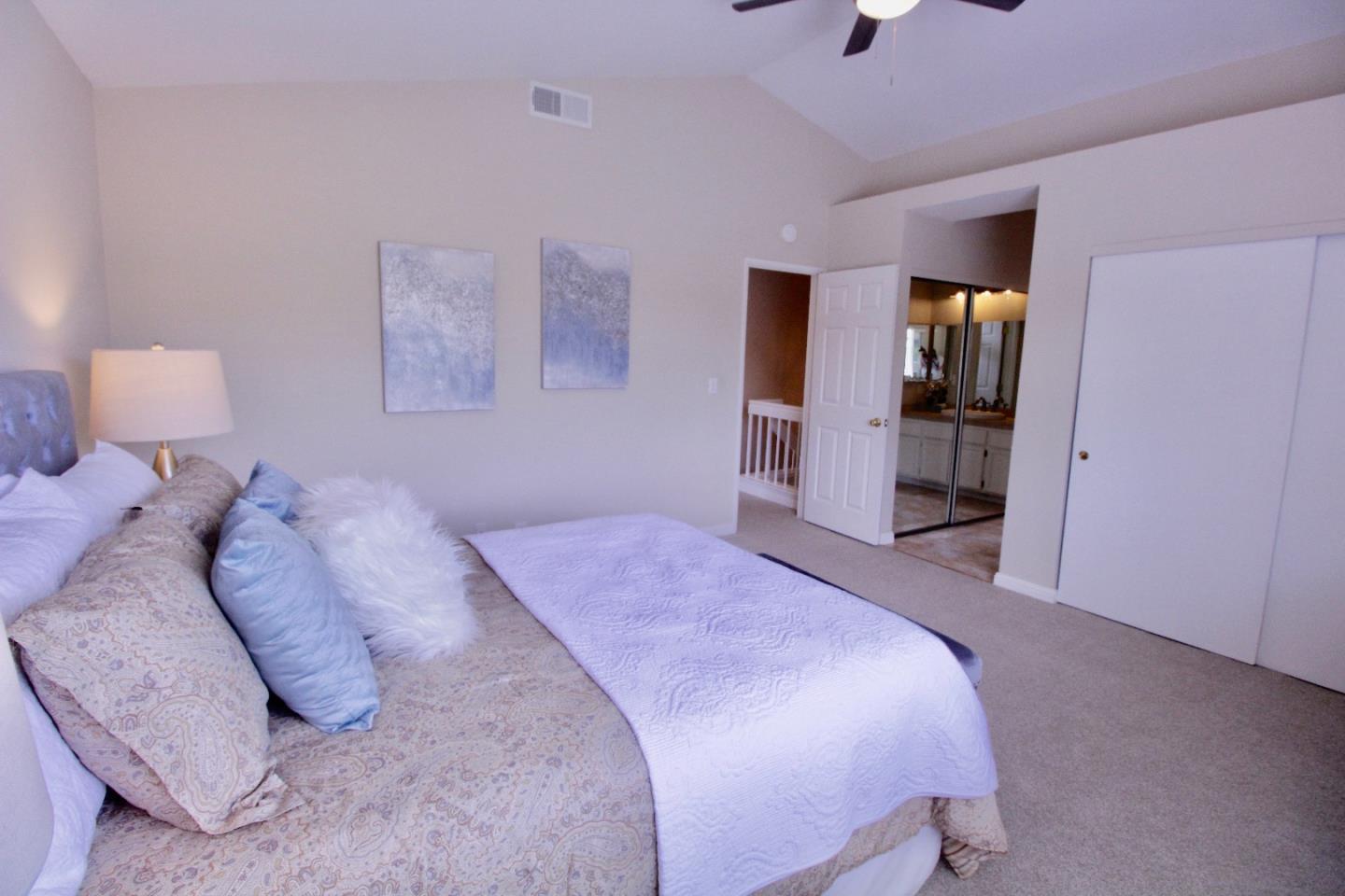 60 Cherryton Lane San Jose, CA 95136 - Photo 19 of 31 a bedroom with a bed and a walk in closet