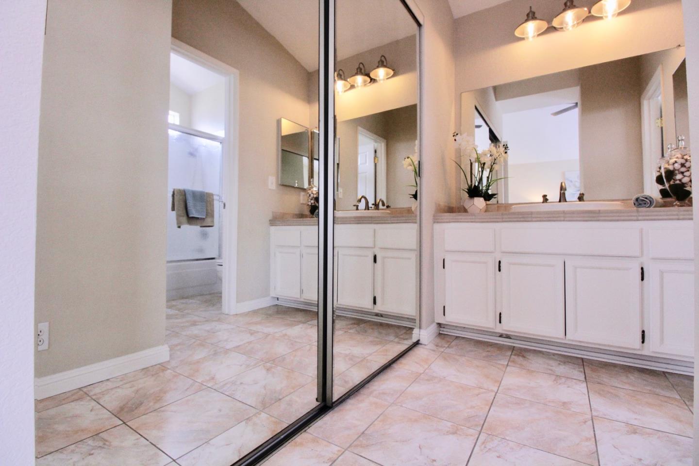 60 Cherryton Lane San Jose, CA 95136 - Photo 20 of 31 a bathroom with a sink and a mirror