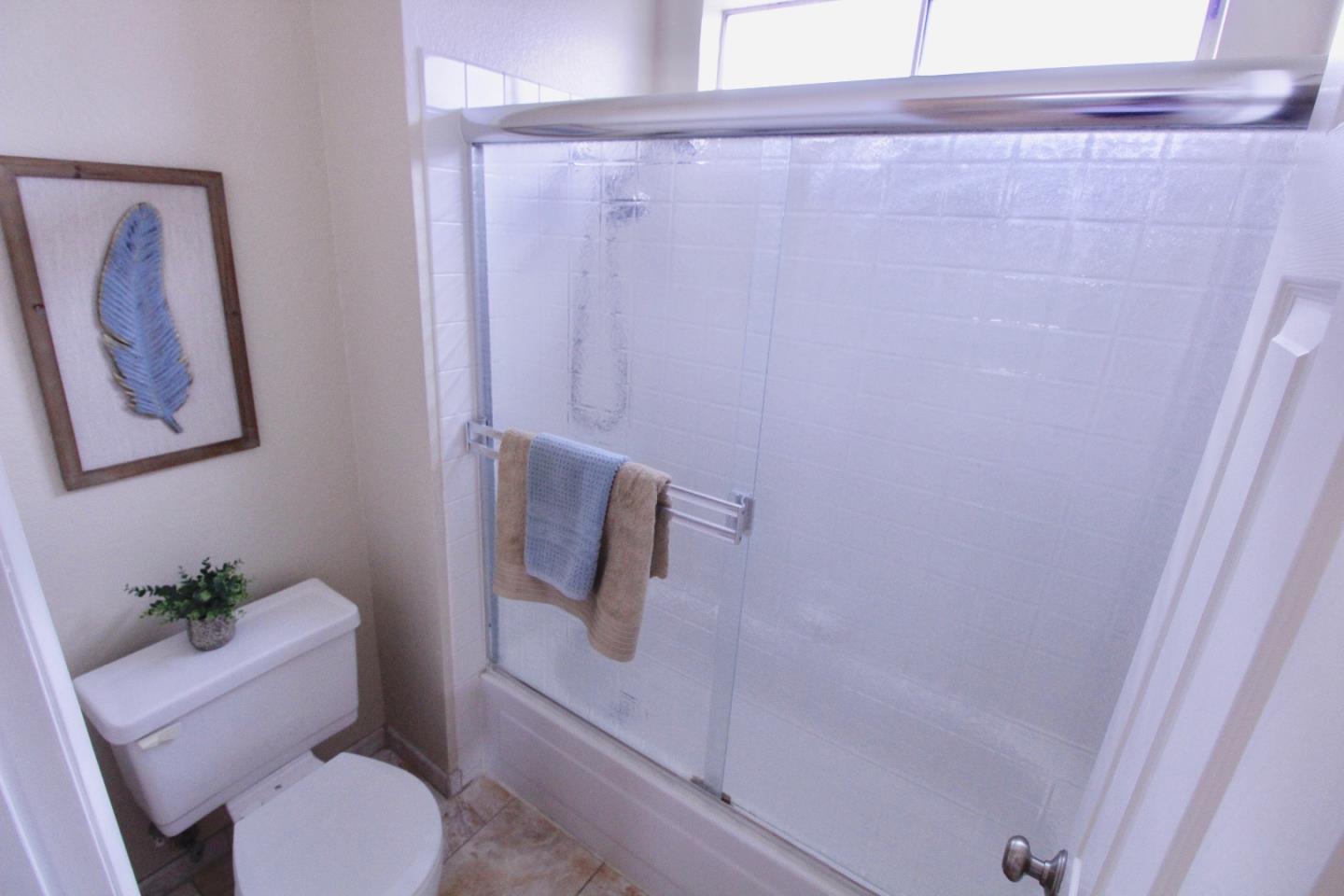 60 Cherryton Lane San Jose, CA 95136 - Photo 21 of 31 a white toilet sitting next to a shower