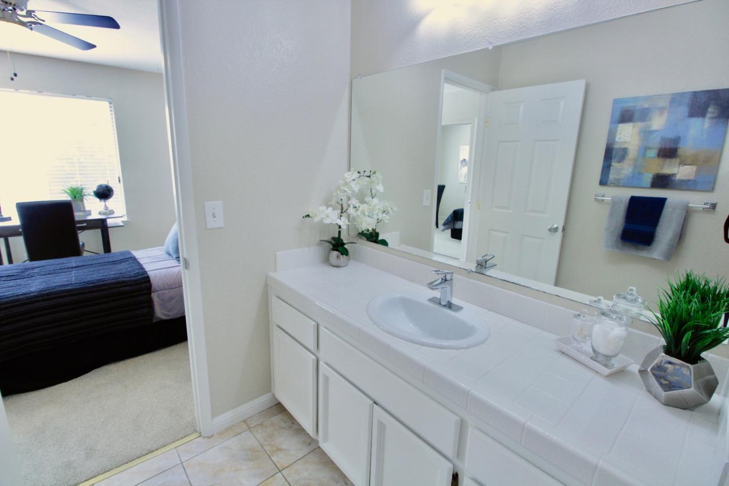 60 Cherryton Lane San Jose, CA 95136 - Photo 24 of 31 a bathroom with a sink and a mirror