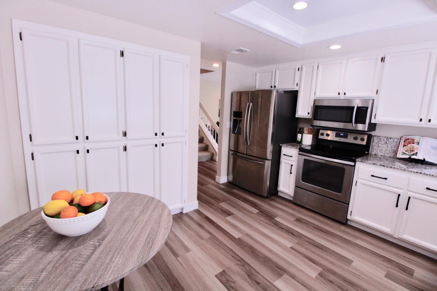 60 Cherryton Lane San Jose, CA 95136 - Photo 8 of 31 a kitchen with stainless steel appliances a refrigerator and a stove