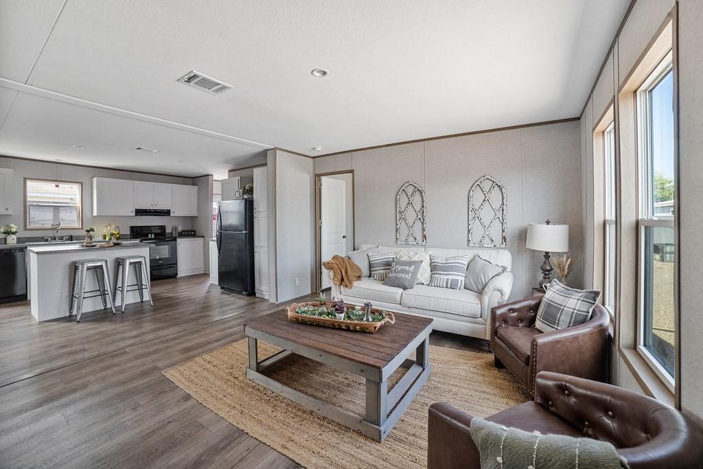 164 Ranya Loop Decatur, TX 76234 - Photo 1 of 31 a living room with furniture and wooden floor